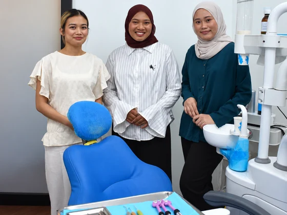 Dental surgery assistants in a treatment room